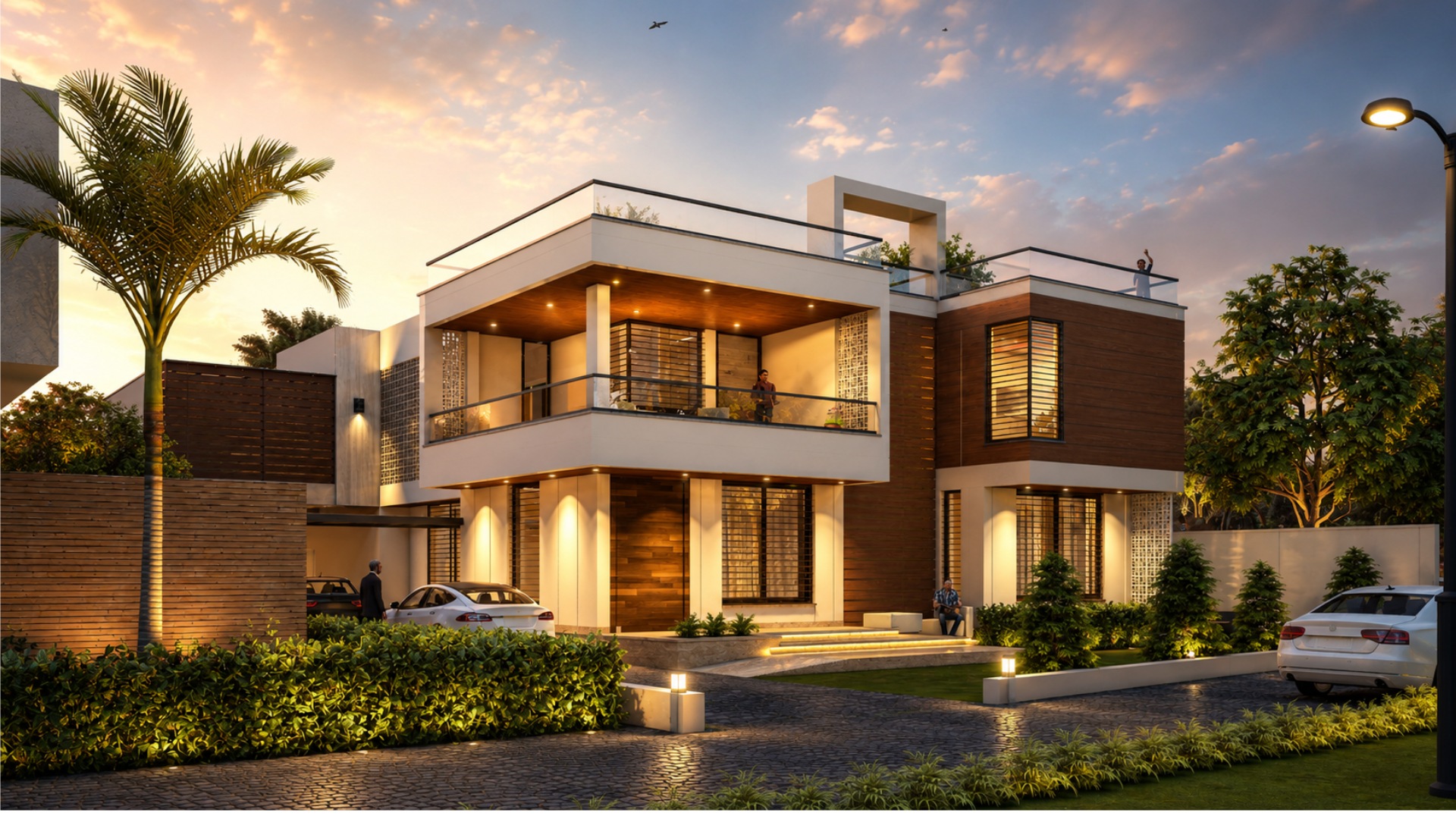 Evening exterior: projecting white frames, recessed balconies and a garden-facing arrival.
